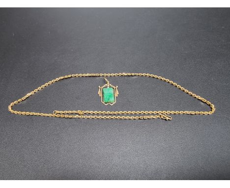 A Chinese yellow metal pendant, set rectangular jade panel, on yellow metal necklace chain. 