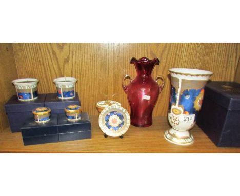 A Royal Worcester vase, trinket pots and candle holders together with a cranberry glass vase,.