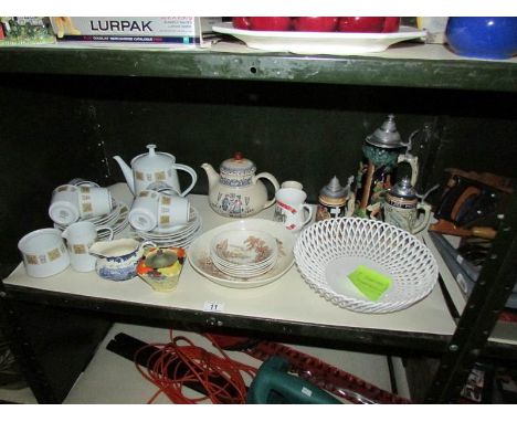 A shelf of assorted teaware, beer steins etc.