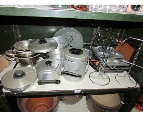 A shelf of kitchen ware.