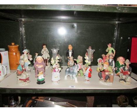 A shelf of assorted figures etc.,