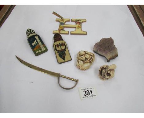 A mixed lot including pen stand, paper clips, netsuke etc.,
