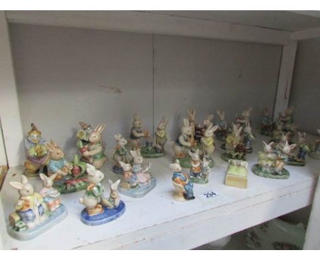 A shelf of rabbit and clown figures,.