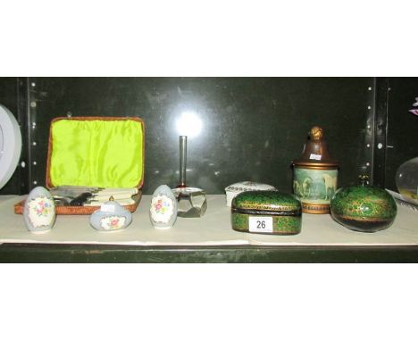 A shelf of miscellaneous items including trinket boxes.