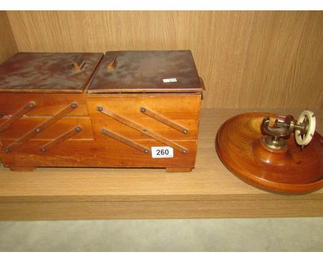 A metamorphic sewing box with contents a/f and a nut dish with nut cracker.