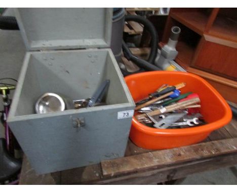 A small wooden box of tools and another box of tools,.