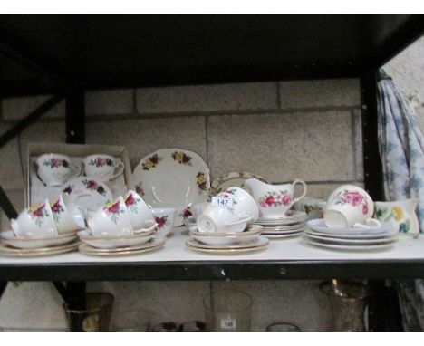 A shelf of assorted tea ware.