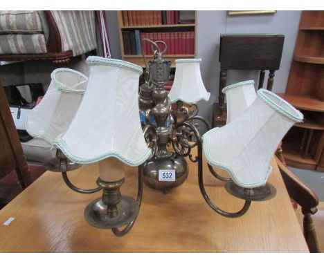 A 6 arm brass ceiling light with ball base.