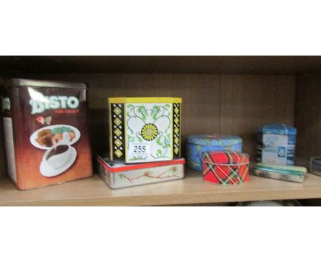 A shelf of assorted tins.