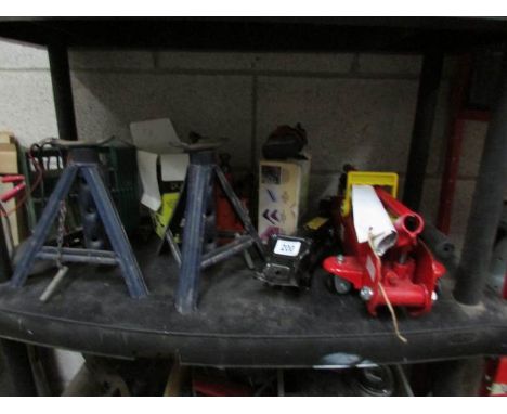 A quantity of car tools including jacks, axle stands etc.