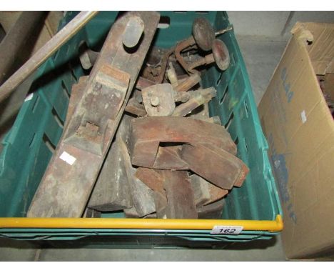 A mixed lot of old woodworking tools including planes, routers, hand drills etc.