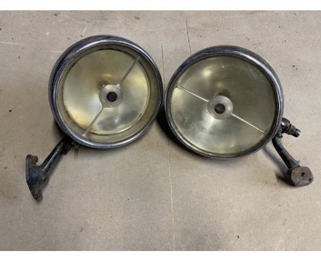 A pair of Lucas L165S headlamps on brackets, fitted previously to a Bugatti.