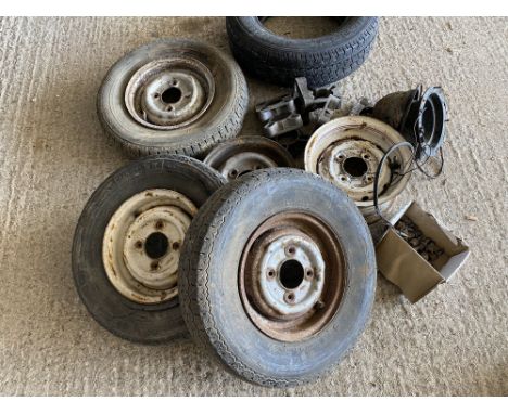 A selection of Mini wheels, alloy wheel spacers, headlamp holder etc.