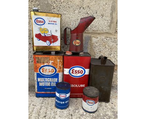A group of Esso oil cans, including a Continental litre can with Mr and Mrs Drip sat in a car, plus Esso grease tins and a pi