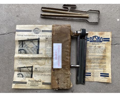 An early Desmo hand operated windscreen wiper, with original instructions and conditions of sale from Desmo, plus one similar