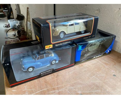 Three large scale models, including Maisto and Minichamps, two Citroen 2CVs and one Morris Minor.