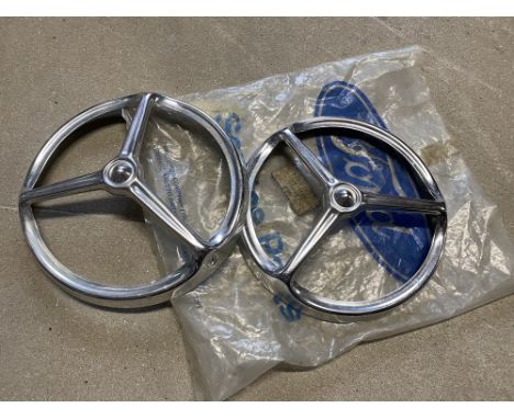 A pair of new old stock Ford three point headlamp covers, possibly early Cortina.