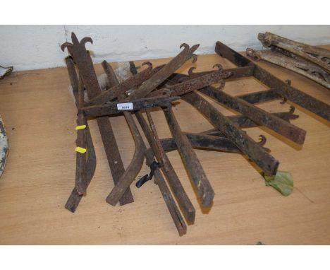 Ten vintage iron brackets
