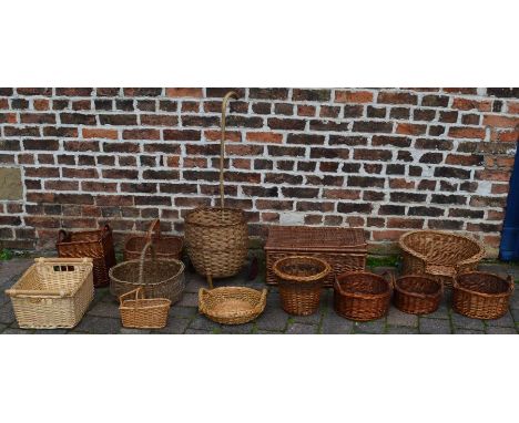 Large quantity of wicker basket ware, including shopper, dog bed, picnic hamper, etc