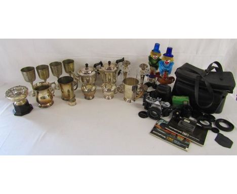 Collection of silver plate includes horn handled tankard, candlesticks, Murano style clowns (one showing heavy damage) and Ol