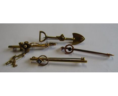 4 gold tie pins / bar brooches - marked 15ct with flower design 3.1g, marked 9ct rose gold pin with possibly garnet 1.9g, tes