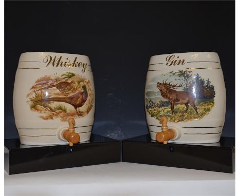 A ceramic whiskey barrel and gin barrel. (2)