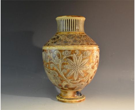 A Martin Brothers vase, signed R W Martin & Bros, with leaves and foliage decoration, Circa 1895. Height 27cm.