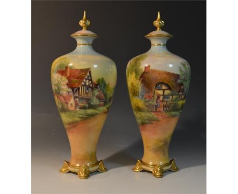 A pair of Royal Worcester vases with covers, signed R. Rushton. depicting named scenes of Harvington and Cropthorne, Worceste