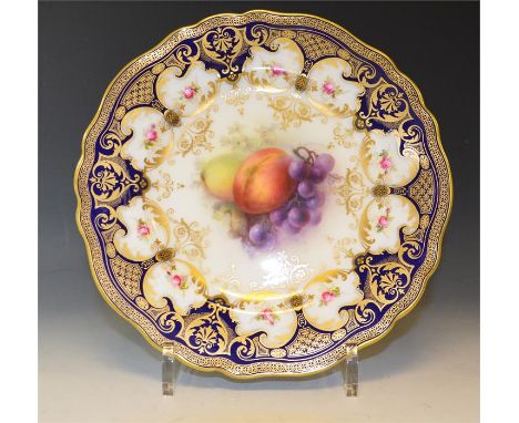 A Royal Worcester fruit plate, signed Sebright. diameter 22cm. Date Code 1909.