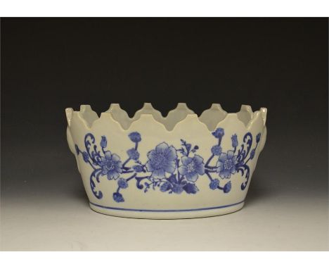A blue and white china planter.
