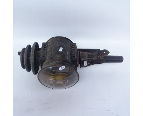 A black painted cast-iron carriage oil lamp with wall mounting bracket, lamp height 51cm 