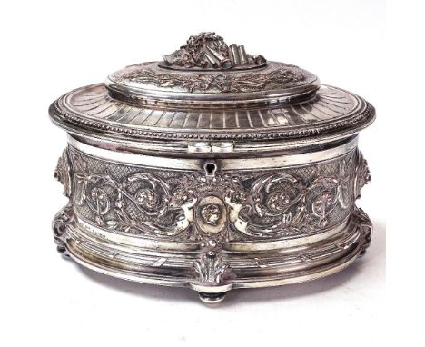 A silver plate on copper oval jewel box, inscribed Olldfy Pre Editeuf, relief embossed cherub and lion mask decoration, lengt