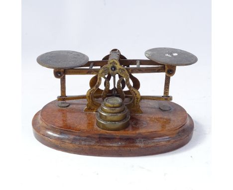 A 19th century Sampson Mordan &amp; Co of London set of postal scales and weights, engraved foliate decoration on mahogany pl
