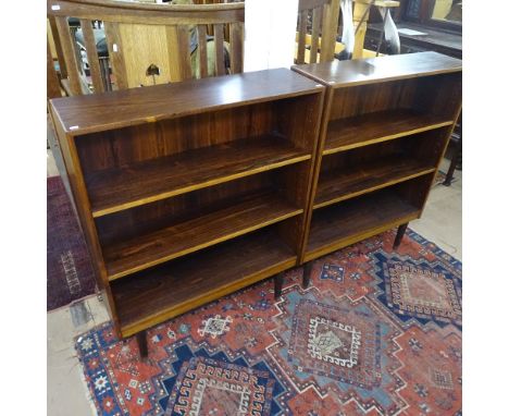 A pair of 1950s Danish rosewood open bookcases, with adjustable shelves, on turned legs, W88cm, D26cm, H11cm, shelf depth 24c