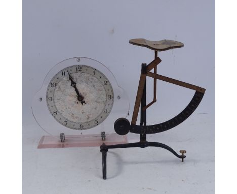 An Art Deco pink lucite mantel clock, and a set of postal scales, clock height 18cm (2) 