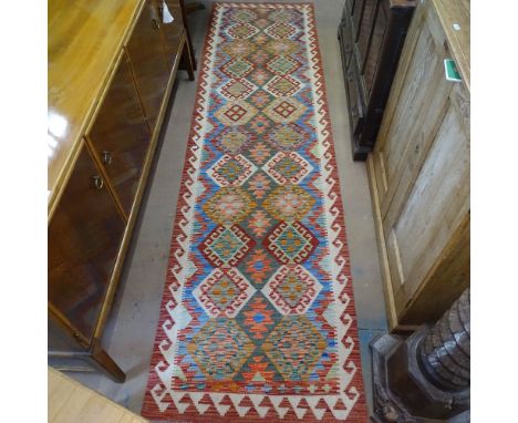 A vegetable dyed wool Choli Kilim runner, 304cm x 80cm 