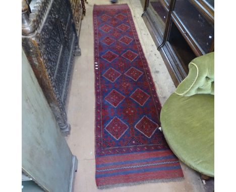A Meshwani red ground runner, 277cm x 59cm 