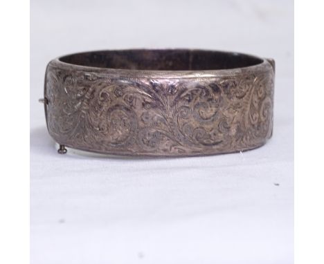 A Liberty &amp; Co floral engraved silver bangle, Birmingham 1984, maker's marks L&amp;Co 