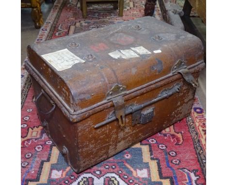 An Antique metal dome-top travel trunk with labels, W52cm, D36cm, H37cm 