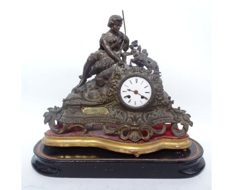A French 19th century cast-brass 8-day mantel clock, surmounted by figure with kidd, on ebonised base (missing dome) 