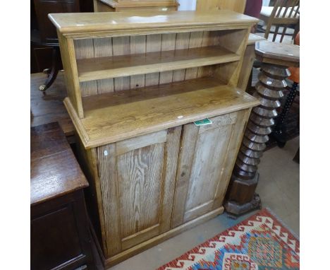 A Victorian pitched pine cabinet with raised shelf-back, 2 panelled doors under, W97cm, D41cm, H138cm 