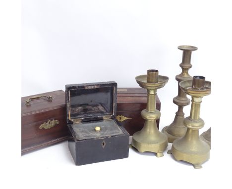 A 19th century mahogany tea caddy, an Eastern ebonised wood tea caddy, mahogany games box, and 2 pairs of brass candlesticks,