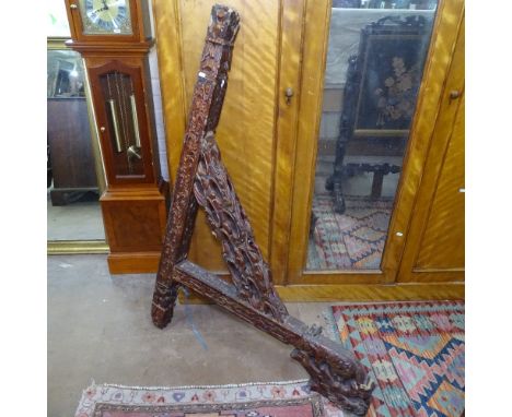 An Antique Chinese temple bracket, with allover carved and pierced decoration, H135cm