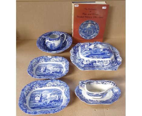 A Spode Italian pattern vegetable tureen and cover, matching serving dishes, jug, and a Dictionary of Blue and White pottery,