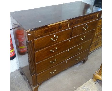 A large 18th century mahogany chest, having 2 banded drawers above 2 short and 3 long drawers, with reeded columns and bracke