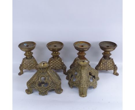 A set of 4 Antique cast-brass candle stands, with lion paw feet, and a pair of cast-brass lamp bases with scrolled acanthus l