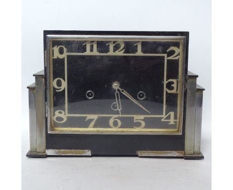 An Art Deco ebonised wood and chrome 8-day mantel clock, case length 30cm 