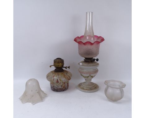 A painted glass oil lamp with a shade and chimney, height 50cm, another oil lamp and 2 glass light shades 