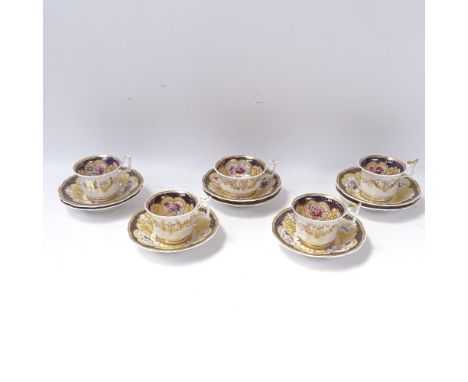 A set of 6 early 19th century English cups and 8 matching saucers, pattern no. 1033, with painted floral sprays, and gilded p