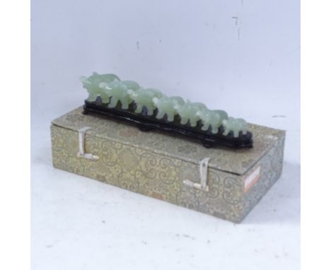A modern set of carved and polished jade elephants, on fitted display stand with original box 